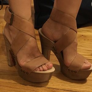 Tan strappy platform heels.
